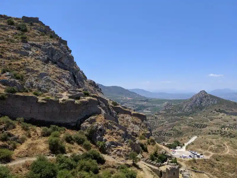 Hilltop fortress ruins overlooking the Peloponnesian countryside from Acrocorinth's steep rocky slopes